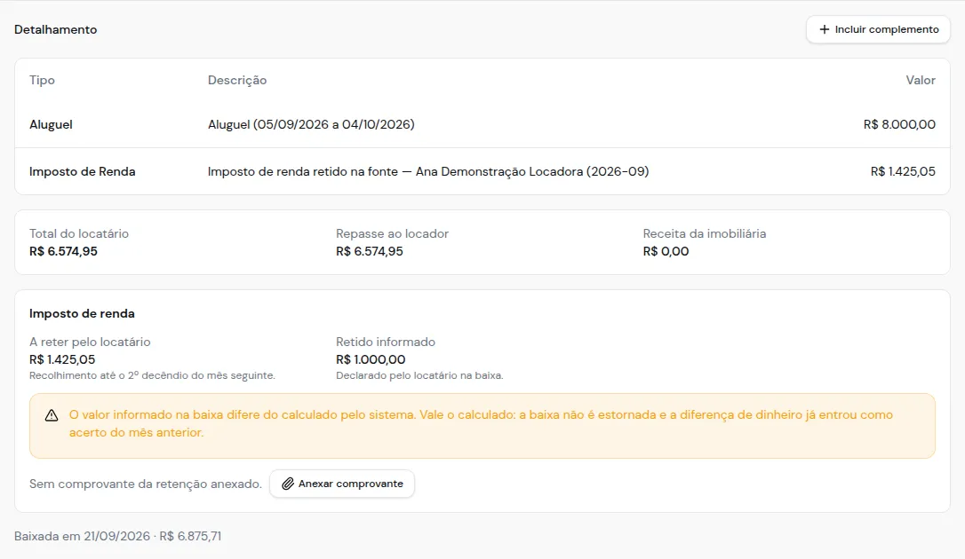Parcela baixada mostrando o valor calculado, o retido informado e o aviso de divergência